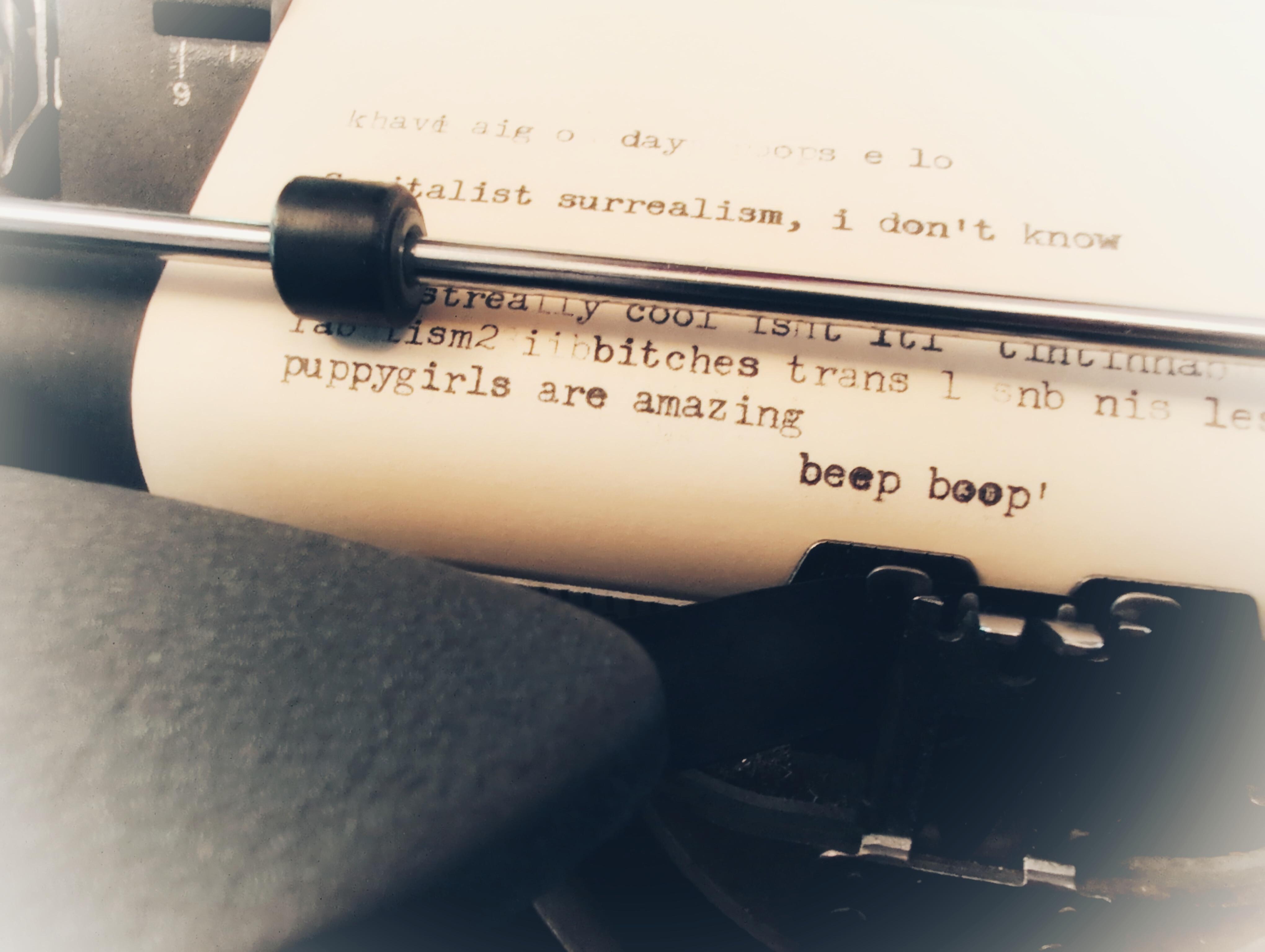 a typewriter with beep boop visible
